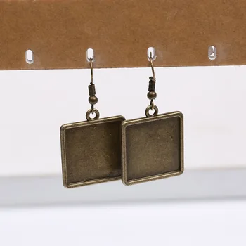 Reidgaller 20pcs antīkas bronzas fit 20mm laukumā cabochon auskars bāzes diy tukšu auskaru āķi secinājumi