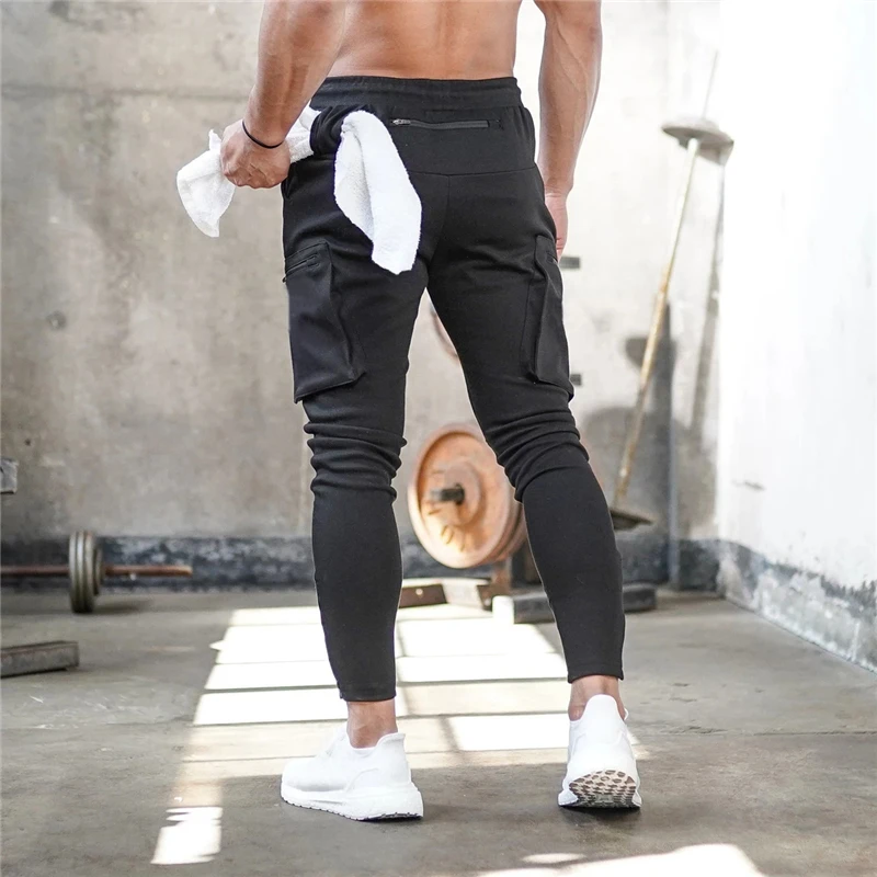 Vīriešu Jogger Pnats Treniņbikses Cilvēks vingrošanas zāles Treniņa Fitnesa Kokvilnas Bikses Vīriešu Gadījuma Modes Izdilis Dziesmu Bikses Rāvējslēdzēju dizaina Bikses